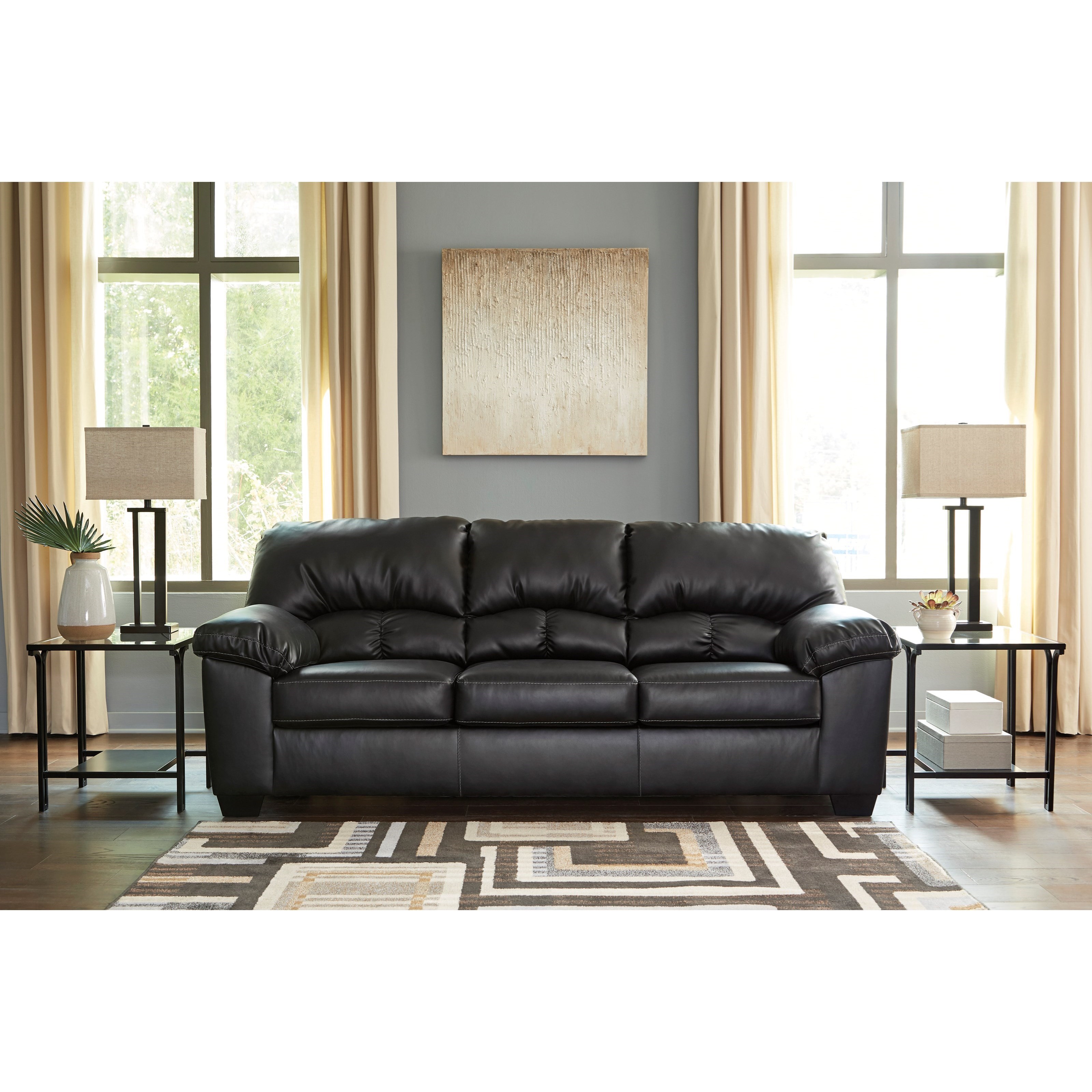 Benchcraft by Ashley Brazoria Casual Faux Leather Sofa | Royal