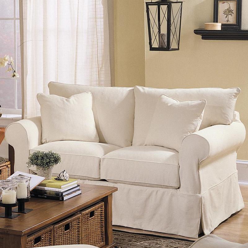 Klaussner Jenny Slipcover Loveseat with Rolled Arms and Skirt Find
